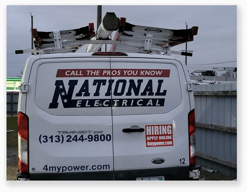 A van with the words " national electrical " on it.