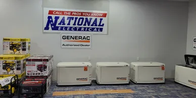A group of generators sitting in front of a wall.